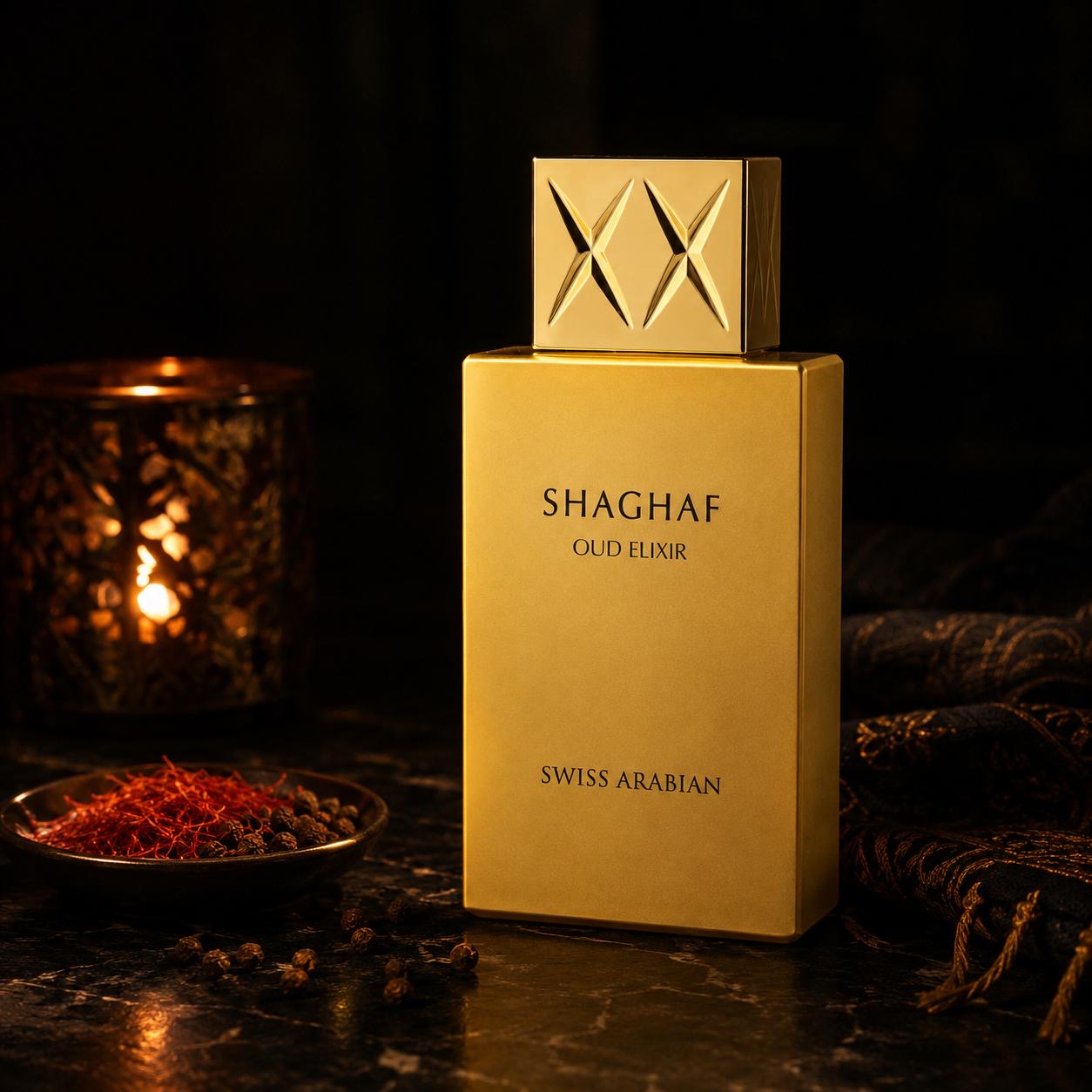 Shaghaf Oud Elixir by Swiss Arabian perfume bottle styled with saffron and pink peppercorns in a dark evening setting
