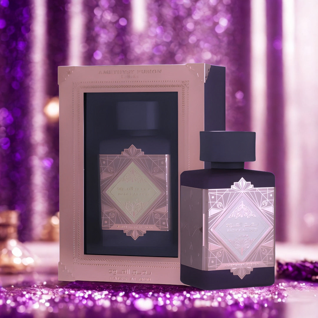 Badee Al Oud Amethyst Infusion by Lattafa 100ml EDP bottle and box on a purple glitter backdrop