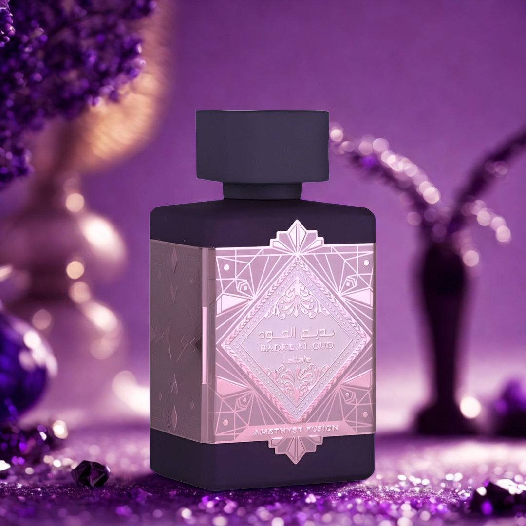Badee Al Oud Amethyst Infusion by Lattafa 100ml EDP bottle on a purple glitter background with dried flowers