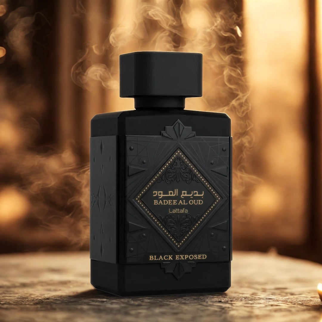 Badee Al Oud Black Exposed by Lattafa 100ml EDP bottle in warm golden light with smoke