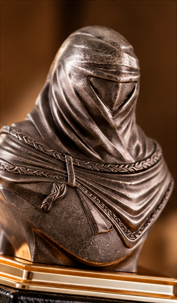 Close-up of the sculpted hooded bust cap on the Maison Asrar Faris Al Arab bottle